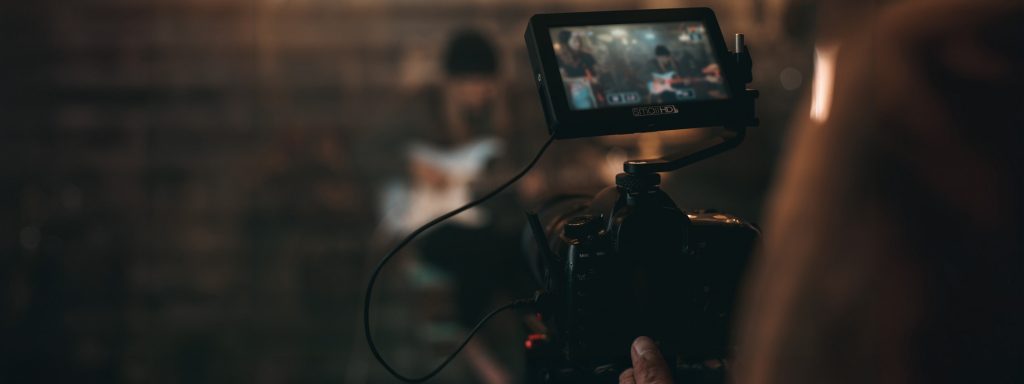 Camera operator framing a shot, showcasing advanced cinematography techniques.